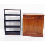 Yew side cabinet with single drawer above two cupboard doors, to plinth base and a 20th century