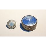 Silver pill box of circular form, the hinged cover set with blue engine-turned enamel, 4cm