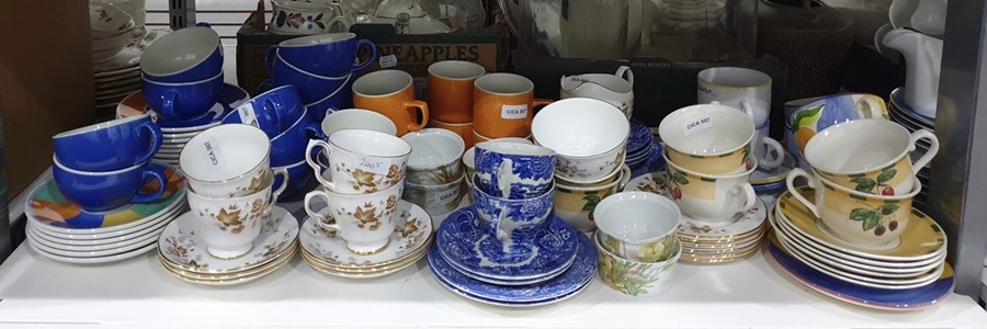 Assorted cups and saucers including blue and white, Colclough, Churchill, china, etc (1 shelf)