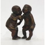 Miniature bronze group of two crying babies in pinafores, some traces of cold paint, possibly