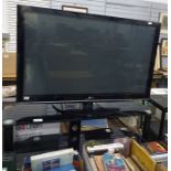 An LG flatscreen television, 50" and a smoked glass television stand (2)