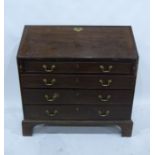 A 19th century mahogany bureau of four long drawers, to bracket feet, brass handle and escutcheon,