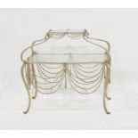 A two-tier lozenge-shaped glass-topped and iron-framed table with iron swag decoration Condition