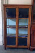 Continental oak display cabinet, the glazed doors enclosing four shelves, 100cm x 171cm