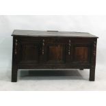 18th century oak coffer with moulded edge above three panels to the front, on style supports,