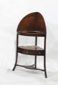 A 19th century mahogany corner washstand with galleried back above holes for bowls, united open