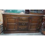 19th century oak dresser base, the rectangular top with moulded edge above three central drawers