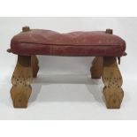 Camel stool with red leather seat