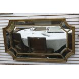 Multi-plate wall mirror, rectangular in form with concave corners, in egg and dart moulded frame