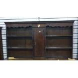 An 18th century and later North Country oak and cross-banded dresser top with assorted shelves and