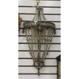 Three-light wall light with strung glass beaded shade  Condition ReportThere are a few holes where