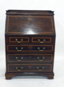 Edwardian Turner & Co mahogany bureau with satinwood banding, the fall front enclosing a cupboard, a