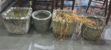 Two pairs of composite stone planters