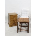 A 20th century pine bedside chest of three drawers, a nest of coffee tables and an office chair (3)