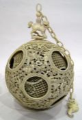 19th century Chinese carved ivory puzzle ball on stand, the ball surmounted by Dog of Fo, the