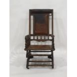 Late 19th/early 20th century rocking chair in brown leather head rest, back and seat