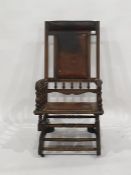 Late 19th/early 20th century rocking chair in brown leather head rest, back and seat