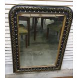 Mirror in ebonised frame with gilt ribbon and vine decoration