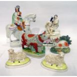 Staffordshire pottery equestrian figure of a Highland bagpiper, a porcelain group of Pero and