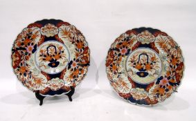 Pair of Imari chargers, late 19th/early 20th century, each painted with a central cartouche and