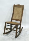 Beech framed cane seated and backed rocking chair