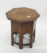 Eastern octagonal folding table with brass inlay Condition ReportThere is small amount of damage