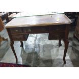 Early 20th century mahogany writing desk, the rectangular top with canted corners and moulded