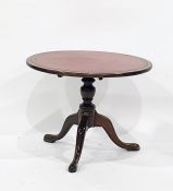 A mahogany centre table with moulded edge, turned column to three cabriole supports, 72.5cm diameter