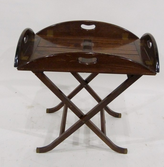 A reproduction mahogany butler's tray on stand