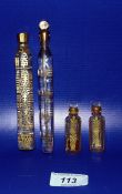 Pair gilt and clear small flattened scent bottles, each shouldered and panelled, floral and