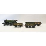 Hornby 0-gauge County of Bedford engine 3821 clockwork train, tender and two other trucks, with an
