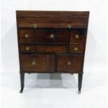 George III mahogany washstand with lift-up top, slide, various drawers, all with brass drop ring