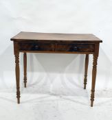 A 19th century two-drawer side table on turned supports, 92cm x 48cm