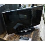 A Samsung flatscreen television, 31" with remote and instructions