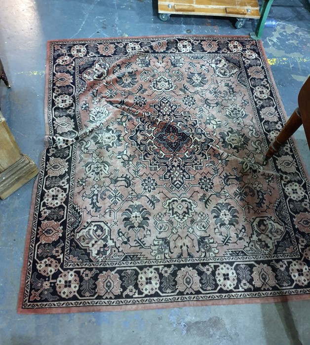 Salmon ground Eastern rug with central medallion,