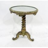 A 19th century mirror-top circular centre table, the moulded edge above a gilt twisted tapering