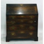 An oak bureau of four drawers, to bracket feet, 89cm x 107cm  Condition ReportSee attached images.