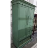 A green painted compactum, the left hand door enclosing shelves, the shorter right hand drawer above