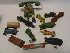 Quantity old diecast model vehicles playworn and a tinplate toy telephone (1 box)