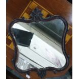 Mahogany framed shaped mirror