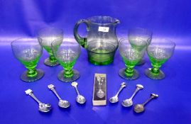 Set of six green glass wines with tapering bowls, matching water jug and small quantity of