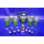 Set of six green glass wines with tapering bowls, matching water jug and small quantity of