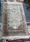 Indian silk rug, all over floral and bird decoration to cream ground with similarly decorated dark