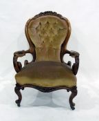 19th century salon armchair with carved top rail, buttonback upholstery, carved and scroll arms,