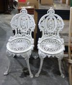 A pair of Coalbrookdale style white painted iron chairs (2)