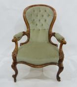 19th century armchair, the spoon-shaped back with light green button back upholstery, carved hand