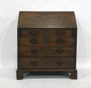 A 19th century oak bureau of four long graduated drawers, to bracket feet, brass handles and