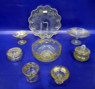 Three gilt glass comports with floral swag and fern decoration, two covered powder bowls, a fruit