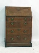 A 18th century oak bureau of one long above two short above two long drawers, with brass swan neck