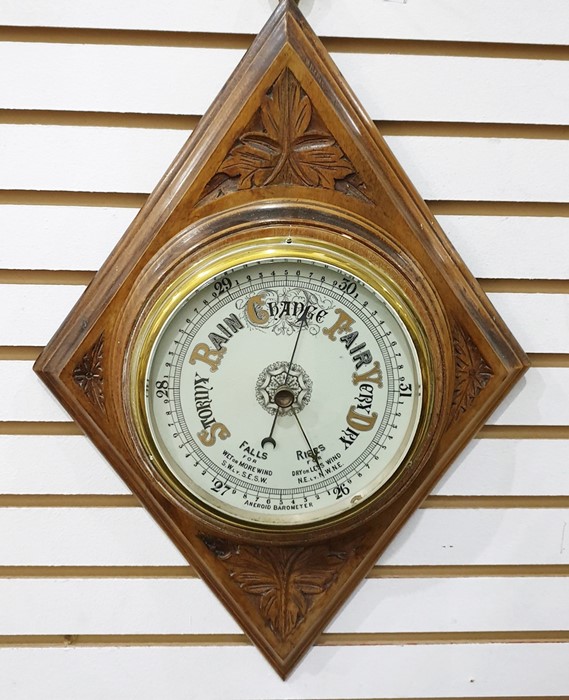 Oak cased aneroid barometer , framed